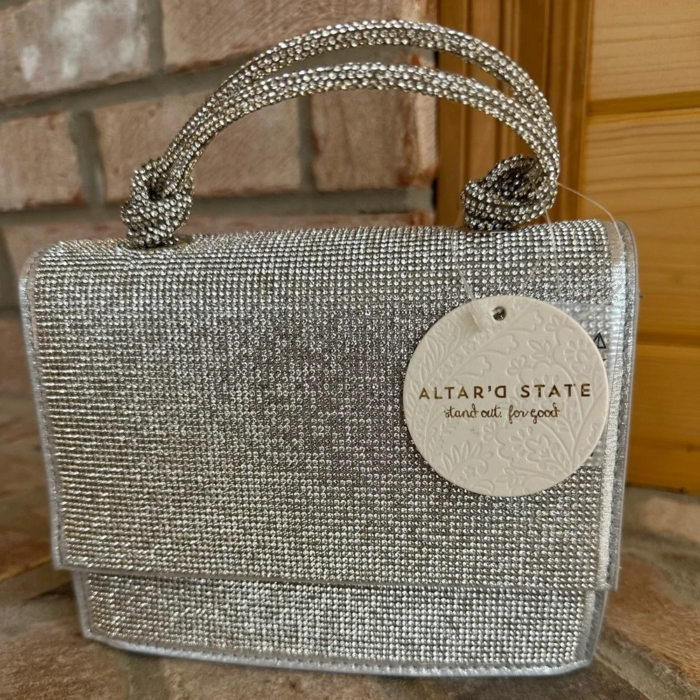 NWT Urban Expressions Silver Clutch/Purse with handle and matching chain straps.